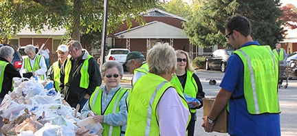 Westhaven Baptist Church members assist with food distribution. The local food bank used to use the church as a drop-off point.
