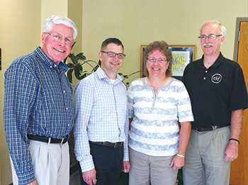Newly elected CBF Heartland coordinator Jeff Langford (second from left) and his predessor in the role, Harold Phillips (right) pose with Heartland Past Moderator Michael Olmsted (left) and Moderator Nancy Thompson. (CBF Heartland)