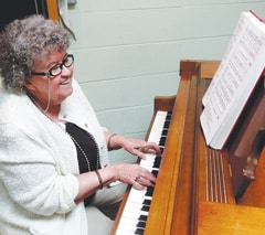Sharon Lynch plays the piano during worship. A member since 1969, she also leads the lone adult Sunday School class. (Brian Kaylor) 