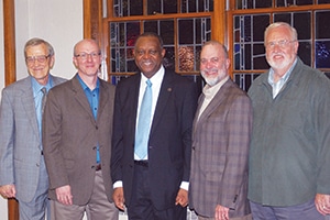 Neville Callam (center), executive secretary of the Baptist World Alliance, poses with guests after an afternoon tea at University Heights Baptist 