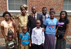 Freddy Lumande (center) and his family were resettled in St. Louis, Mo., from Burundi, where he worked as a Baptist pastor and church planter. His church, located in the capital, was working to strengthen churches in more rural communities. He and his oldest son have found good jobs, and the other children are happy attending school. Still, he struggles with the knowledge that his family, friends and church members still in Bujumbura, where violence has plagued the capital for several months. He balances a modest budget to support his growing family here while sending money home to Burundi to support the rest of his family and the efforts of the church there. (Tower Grove Baptist Church, St. Louis)