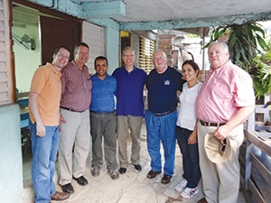 A team of Baptists from Missouri and a Cuban pastor and translator pose for a photo outside a church building on the outskirts of Santiago de Cuba. They are (l-r) Brian Kaylor and Gary Snowden, of Churchnet; Cuban pastor Joey; John Jackson, Future Leadership Foundation; Roger Hatfield, FLF and The Baptist Home; Cuban translator Ester; and Steven Jones, TBH. Another Missouri team member was Steve Hemphill, FLF, who was not present for the photo.