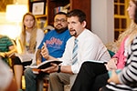 Will Nunn (right) works with students. (MBU)