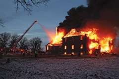 Firefighters engage a fire that engulfed rural Antioch Baptist Church building in Ralls County, Missouri, after midday on Dec. 20., but the flames destroyed the structure despite their best efforts. (Photos by Eric Dundon, courtesy of the Hannibal Courier-Post)