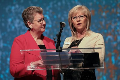 Woman's Missionary Union Executive Director and Treasurer Sandra Wisdom-Martin, left, and national WMU President Linda Cooper deliver the WMU report June 14 on the last day of the two-day Southern Baptist Convention annual meeting at the Phoenix Convention Center. The report highlighted the Christian Women's and Men's Job Corps. Photo by Matt Jones