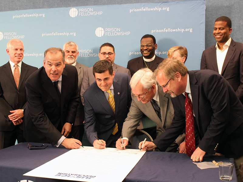 Leaders of evangelical organizations sign the “Justice Declaration,” a statement by Christian leaders on criminal justice reform, in Washington, D.C., on June 20, 2017. Left to right, Prison Fellowship Ministries President James Ackerman, Southern Baptist ethicist Russell Moore, National Association of Evangelicals President Leith Anderson, and David Carlson of the Colson Center for Christian Worldview. RNS photo by Adelle M. Banks
