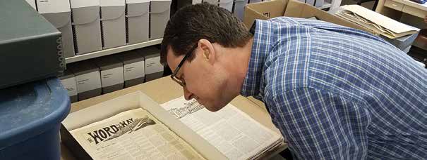 Brian Kaylor looking at the first issue of Word&Way. (Ken Satterfield/Word&Way)