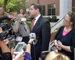 Rowan County Clerk Kim Davis, right, listens as her attorney Roger Gannam addresses the media on the steps of the U.S. District Court for the Eastern District of Kentucky in Covington on July 20, 2015. Davis, who has said she cannot issue marriage licenses to same-sex couples because it would violate her religious beliefs, is being sued by the American Civil Liberties Union on the behalf of two gay couples and two straight couples. (AP Photo/Timothy D. Easley)
