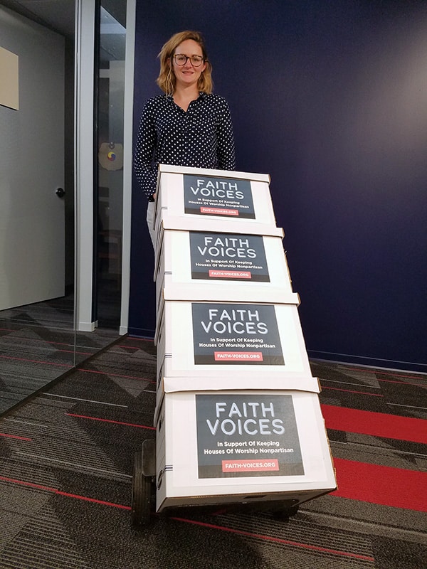 Elise Helgesen Aguilar, federal legislative counsel for Americans United for Separation of Church and State, prepares boxes of letters from clergy who are opposed to changing the law to allow houses of worship to engage in partisan politicking for delivery to Capitol Hill. Photo courtesy of Americans United