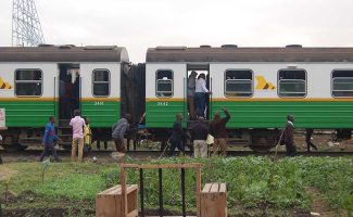A section of coaches of a Kenyan train that takes commuters between Ruiru and Nairobi City, shown at Mutindwa crossing point in east Nairobi on Sept. 28, 2017. The train is seeing increased religious activity. Photo by Fredrick Nzwili