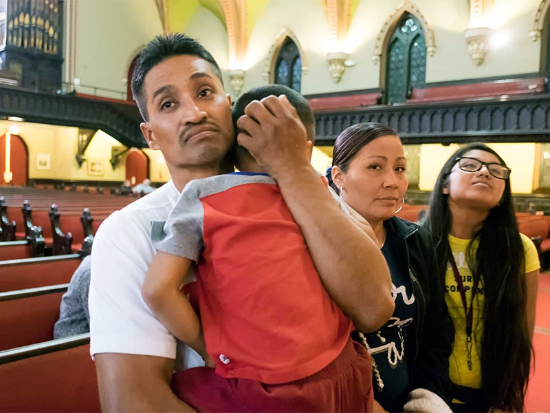 Javier Flores, an undocumented Mexican man facing deportation, sought and received sanctuary in the Arch Street United Methodist in Philadelphia, Penn. Flores cradles his 4-year-old son Javier, with his wife Alma and daughter Adamaris standing by his side, inside the Arch Street United Methodist Church where he was granted sanctuary on Nov.13, 2016. Photo courtes of Philly.com/Ed Hille