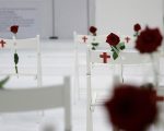 A memorial for the victims of the shooting at Sutherland Springs First Baptist Church, including 26 white chairs each painted with a cross and and rose, is displayed in the church Sunday, Nov. 12, 2017, in Sutherland Springs, Texas. A man opened fire inside the church in the small South Texas community last week, killing more than two dozen. (AP Photo/Eric Gay)