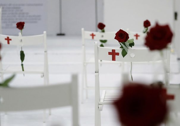 A memorial for the victims of the shooting at Sutherland Springs First Baptist Church, including 26 white chairs each painted with a cross and and rose, is displayed in the church Sunday, Nov. 12, 2017, in Sutherland Springs, Texas. A man opened fire inside the church in the small South Texas community last week, killing more than two dozen. (AP Photo/Eric Gay)