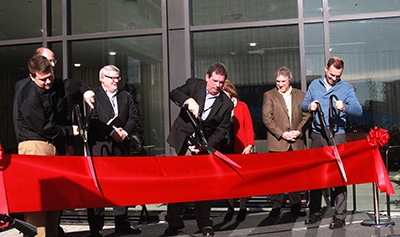 LifeWay President and CEO Thom S. Rainer (center) is joined by Carlton Capps, manager of the Nashville LifeWay Store (left), Eric Geiger, LifeWay senior vice president and CBO (right) and members of the executive leadership team in cutting the ribbon to celebrate the grand opening of the SBC entity's new corporate headquarters and LifeWay Store in downtown Nashville. (Katie Shull/LifeWay)
