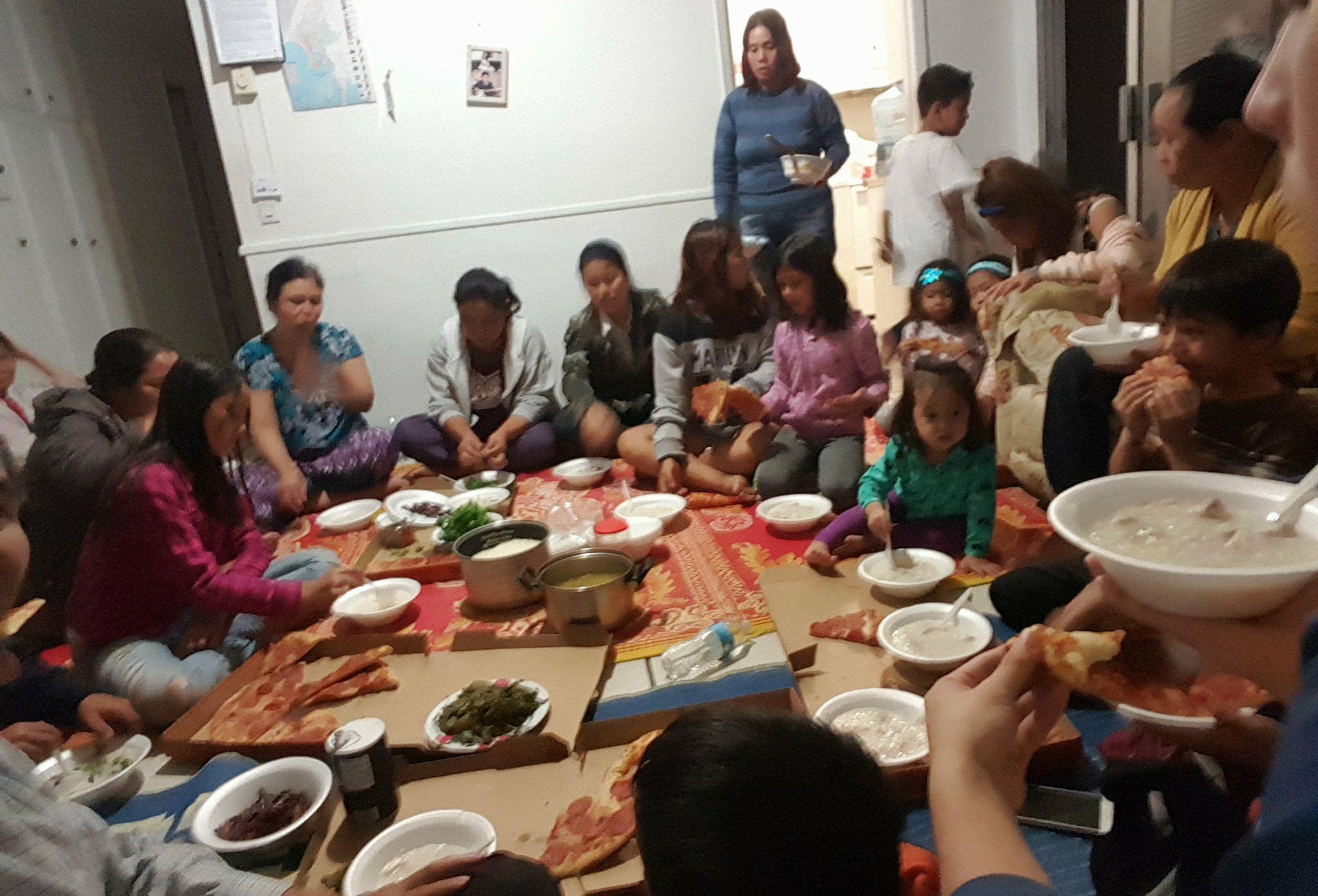 Members of Agape Myanmar Mission share a Burmese meal after their Sunday worship in San Diego's City Heights neighborhood. (Submitted photo)