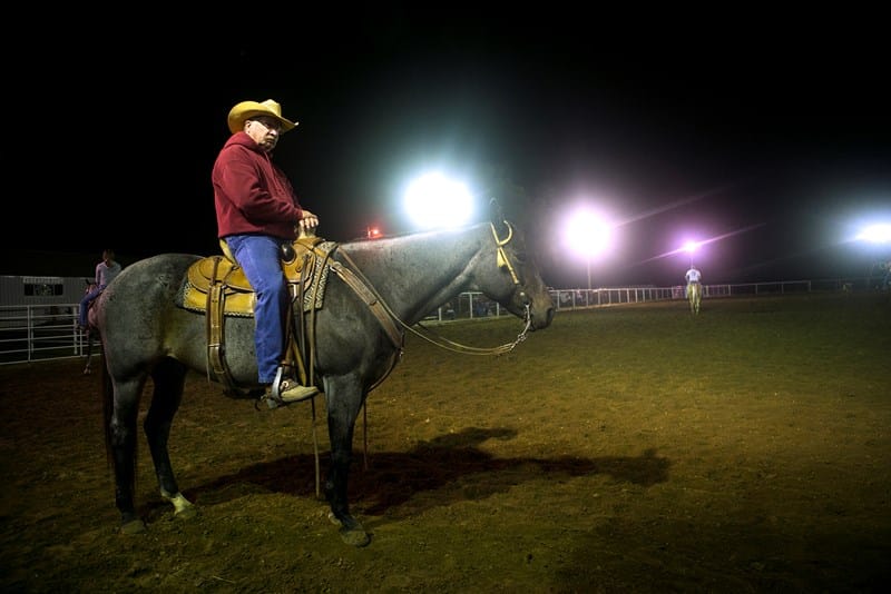 From his perch, bivocational pastor Don Mayberry keeps watch at Three Wooden Crosses cowboy church's lighted arena in rural Kansas. On the back of his horse is his favorite place to preach. (Photo: Sue Sprenkle)