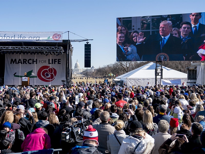 President Trump speaks via a live feed to anti-abortion activists as they rally on the National Mall in Washington on Jan. 19, 2018, during the annual March for Life. (AP Photo/Andrew Harnik; caption amended by RNS)