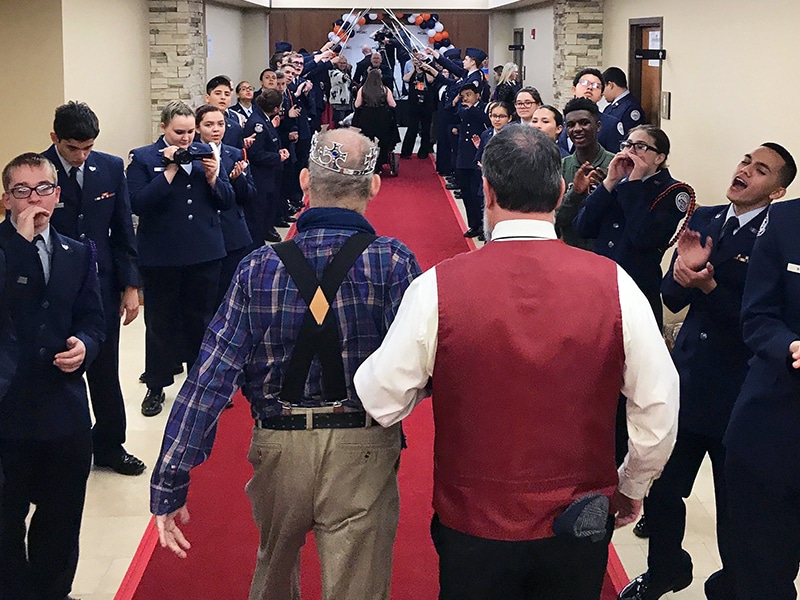 The Air Force Junior ROTC cheers a "king" arriving on the red carpet at the "Night to Shine" event hosted by the Putnam City Baptist Church in Oklahoma City on Feb. 9, 2018. RNS photo by Bobby Ross Jr.