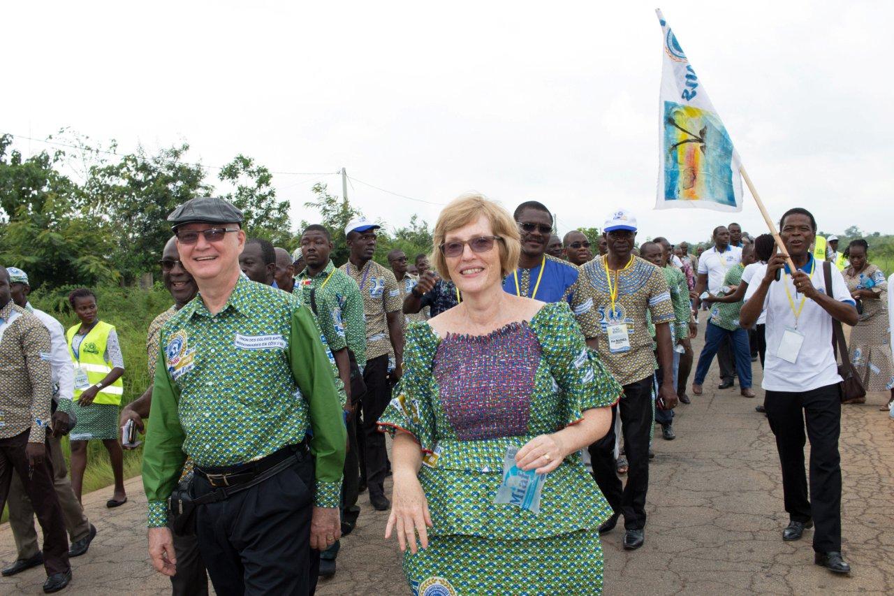 Randy and Kathy Arnett celebrate the 50th anniversary of Baptist work in Cote d’Ivoire in August 2016, walking about two miles to a seminary alongside fellow Christians. The Arnetts, who died March 14, were known for the joy they shared with African friends and colleagues. (IMB Photo by William Haun)