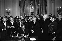 217px Lyndon Johnson signing Civil Rights Act July 2 1964