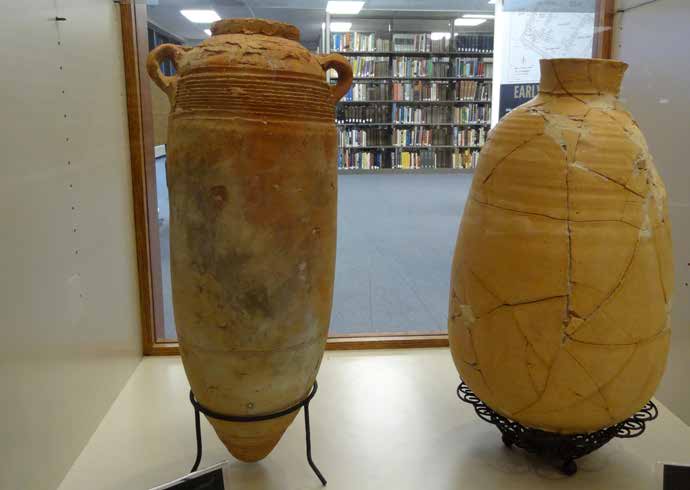 Two pottery jars with books in the SBU library in the background. The one on the left is from 100-400 A.D. The one of the right is from the 1st century A.D. (Photo: Brian Kaylor)