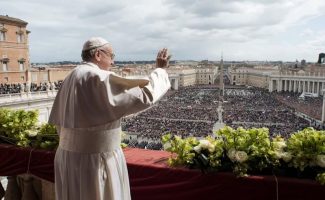 Pope Francis delivers the Urbi et Orbi (to the city and to the world) blessing at the end of the Easter Sunday Mass in St. Peter's Square at the Vatican, Sunday, April 1, 2018. (Vatican Media via AP)