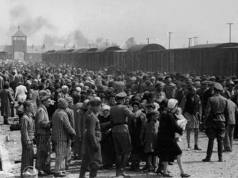 The "selection" of Hungarian Jews on the ramp at the death camp Auschwitz-II (Birkenau) in Poland during German Nazi occupation in May/June 1944. Jewish arrivals were sent either to work or to the gas chamber. Photo courtesy of Creative Commons