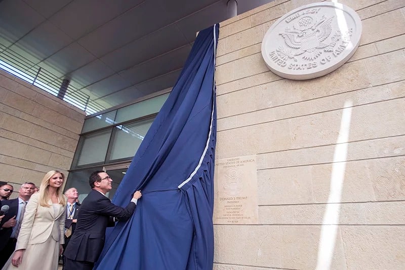 U.S. President Trump’s daughter Ivanka, left, and U.S. Treasury Secretary Steve Mnuchin unveil a plaque during the opening ceremony of the new U.S. embassy in Jerusalem, on May 14, 2018. Amid deadly clashes along the Israeli-Palestinian border, President Trump’s top aides and supporters on Monday celebrated the opening of the new U.S. Embassy in Jerusalem as a campaign promise fulfilled. (Flash90 Photo/Yonatan Sindel via AP)