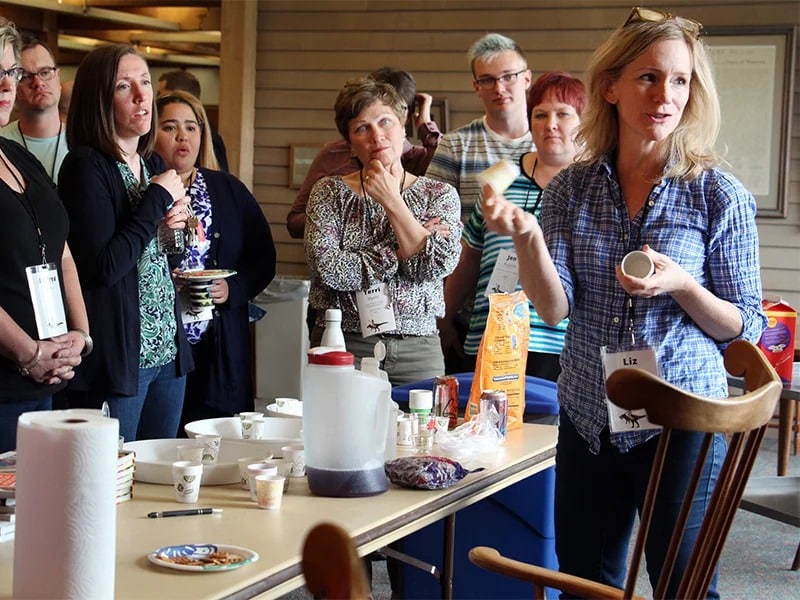 Liz Heinecke, right, demonstrates a science experiment for attendees during the Jesus Rode A Dinosaur conference on May 8, 2018, in Minneapolis. RNS photo by Emily McFarlan Miller