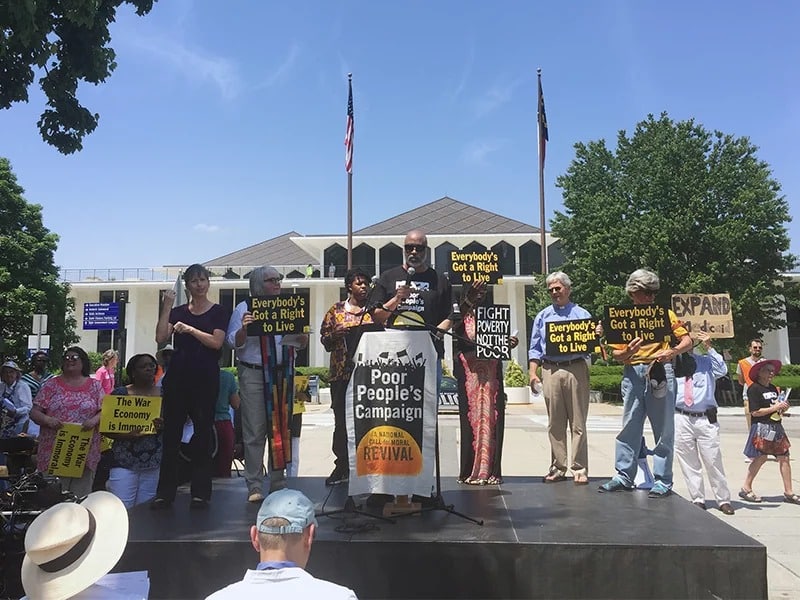 Derick Smith, a political education coordinator for the Poor People’s Campaign, speaks to the crowd in Raleigh, N.C., on May 14, 2018 in front of the state legislature building. Coordinated events occurred at many state capitols across the country. RNS photo by Yonat Shimron