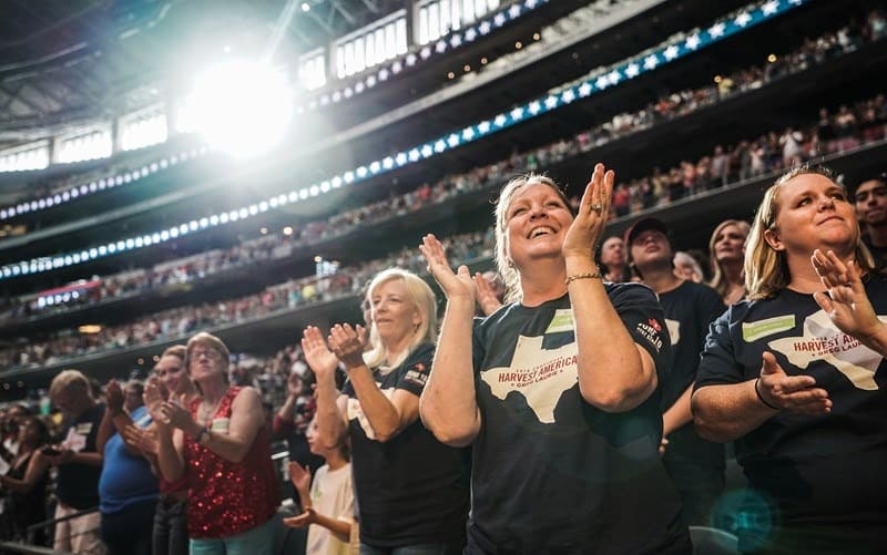 Thousands of attendees at the June 10 Crossover Harvest America crusade at AT&T Stadium in Dallas worshiped together. The crusade featured music from top Christian artists such as Phil Wickham, Chris Tomlin, David Crowder, Trip Lee, Tedashii, KB and Switchfoot. Photo by Matt Miller