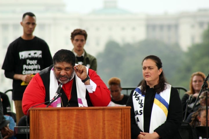The Rev. William Barber II, left, and the Rev. Liz Theoharis, co-chairs of the Poor People’s Campaign: A National Call for Moral Revival, lead the rally on the National Mall in Washington on June 23, 2018. RNS photo by Adelle M. Banks