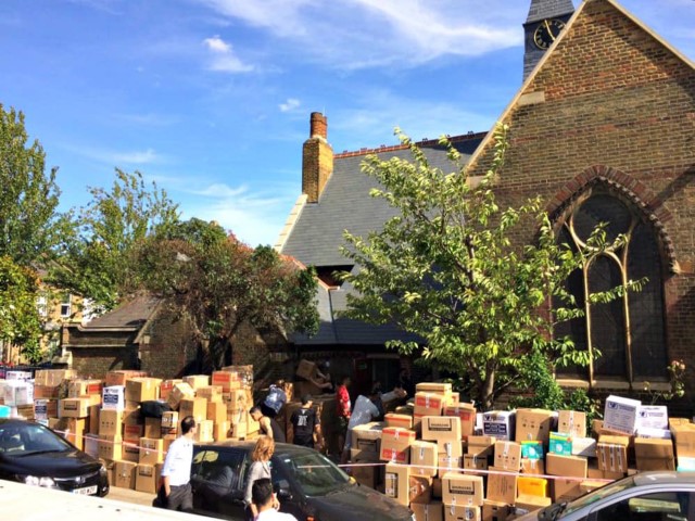 Donations are piled outside of St. Clement’s Church in Notting Dale after the Grenfell Tower file in west London. Photo courtesy Diocese of London