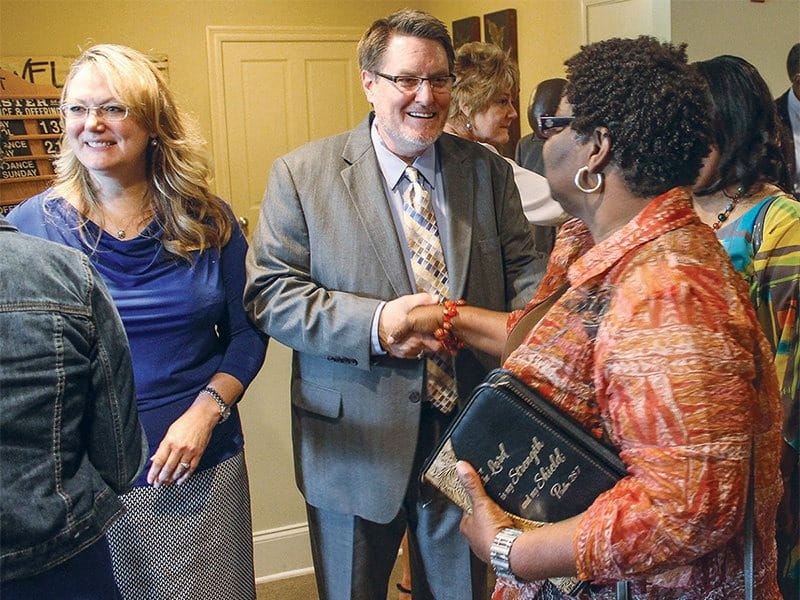 Minister Les Ferguson Jr. and his wife, Becki, left, greet church members after a Sunday morning assembly at the Lake Harbour Church of Christ in Ridgeland, Miss., north of the state capital of Jackson, in 2014. RNS photo by Bobby Ross Jr