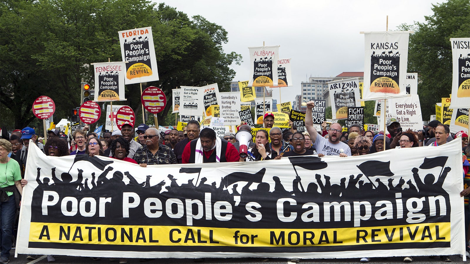 Demonstrators march outside the U.S. Capitol during the Poor People's Campaign rally at the National Mall in Washington on June 23, 2018. (AP Photo/Jose Luis Magana)