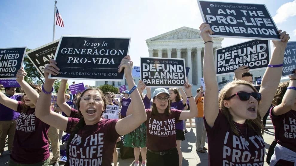 Pro-life and anti-abortion advocates demonstrate in front of the Supreme Court early Monday, June 25, 2018. The justices are expected to hand down decisions today as the court's term comes to a close. (AP Photo/J. Scott Applewhite)
