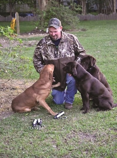 Johnny Morgan uses his three Labrador retrievers for visual illustrations and humor to convey timeless biblical truths in sharing the Gospel. (Submitted photo)