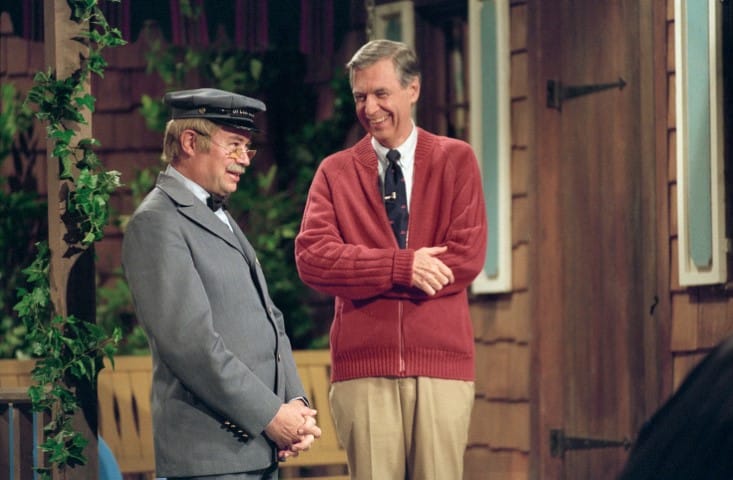 Fred Rogers, right, and David Newell, as Speedy Delivery’s Mr. McFeely, stand on the front porch set while filming an episode of “Mister Rogers’ Neighborhood.” Photo by Lynn Johnson via Focus Features