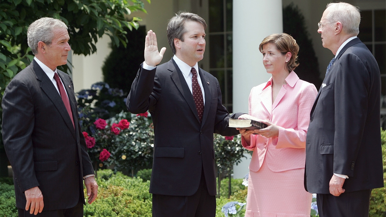 In this June 1, 2006, file photo, from left to right, President Bush watches the swearing-in of Brett Kavanaugh as judge for the U.S. Court of Appeals for the District of Columbia by U.S. Supreme Court Associate Justice Anthony M. Kennedy, far right, during a ceremony in the Rose Garden of the White House, in Washington. Holding the Bible is Kavanaugh’s wife, Ashley Kavanaugh. (AP Photo/Pablo Martinez Monsivais)