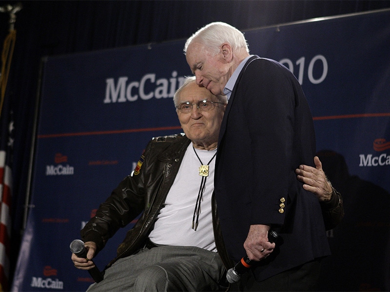 Sen. John McCain, right, hugs retired Air Force Col. George “Bud” Day after Day’s endorsement and kind words about the senator at a campaign rally at a Veterans Town Hall Meeting and endorsement news conference at the American Legion Post #1 Luke-Greenway on Feb. 18, 2010, in Phoenix. The two were POW cellmates in Vietnam. (AP Photo/Ross D. Franklin)