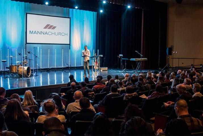 Pastor Joe Adams speaks during a service at Manna Church in Colorado Springs, Colo. held at Pikes Peak Community College. Photo by Will Reinier