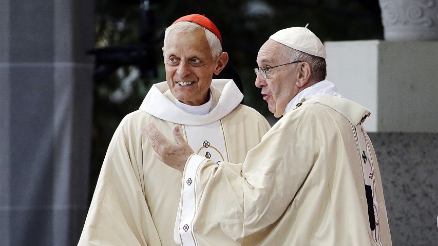 In this Sept. 23, 2015, file photo, Cardinal Donald Wuerl, archbishop of Washington, left, looks toward the crowd with Pope Francis after a Mass outside the Basilica of the National Shrine of the Immaculate Conception in Washington. Wuerl wrote to priests to defend himself on the eve of the scheduled Aug. 14, 2018, release of a grand jury report investigating child sexual abuse in six of Pennsylvania's Roman Catholic dioceses. (AP Photo/David Goldman)