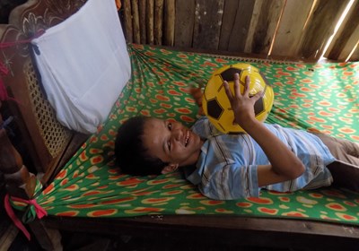 A bedridden boy in Nicaragua responds in joy when Cresthill Baptist Church in Bowie, Md., volunteers ministered to him and other families with special needs. Baptist Convention of Maryland/Delware photo