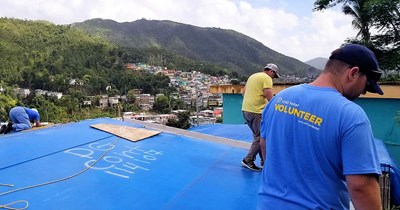 Send Relief volunteers replace a roof on one of tens of thousands of homes still in need of repair in Puerto Rico a year after Hurricane Maria devastated the island. Send Relief photo