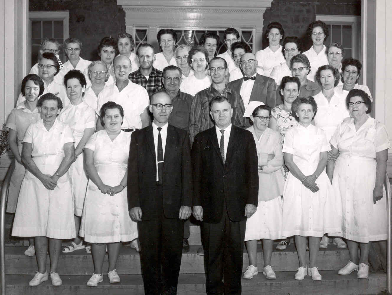John Burney, pictured with staff as superintendent