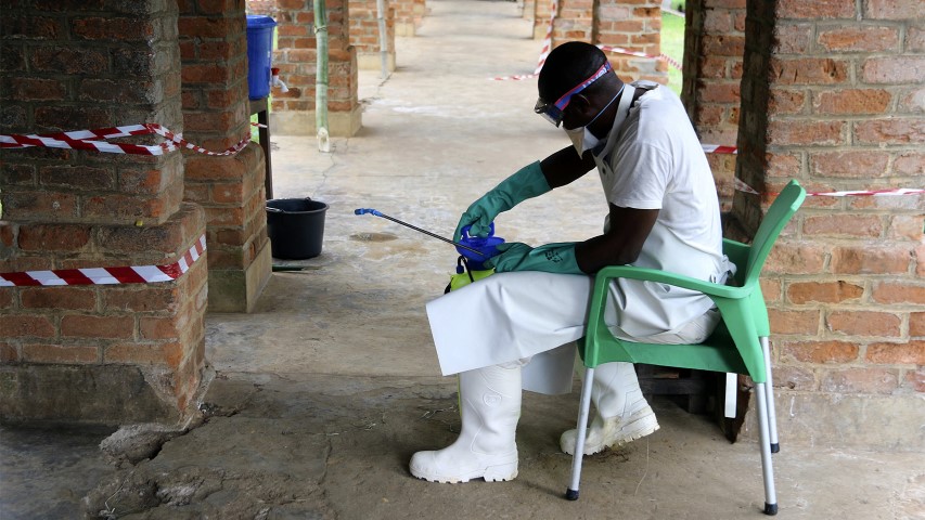 A health care worker wears virus protective gear at a treatment center in Bikoro, Democratic Republic of Congo, on May 13, 2018. (AP Photo/John Bompengo)