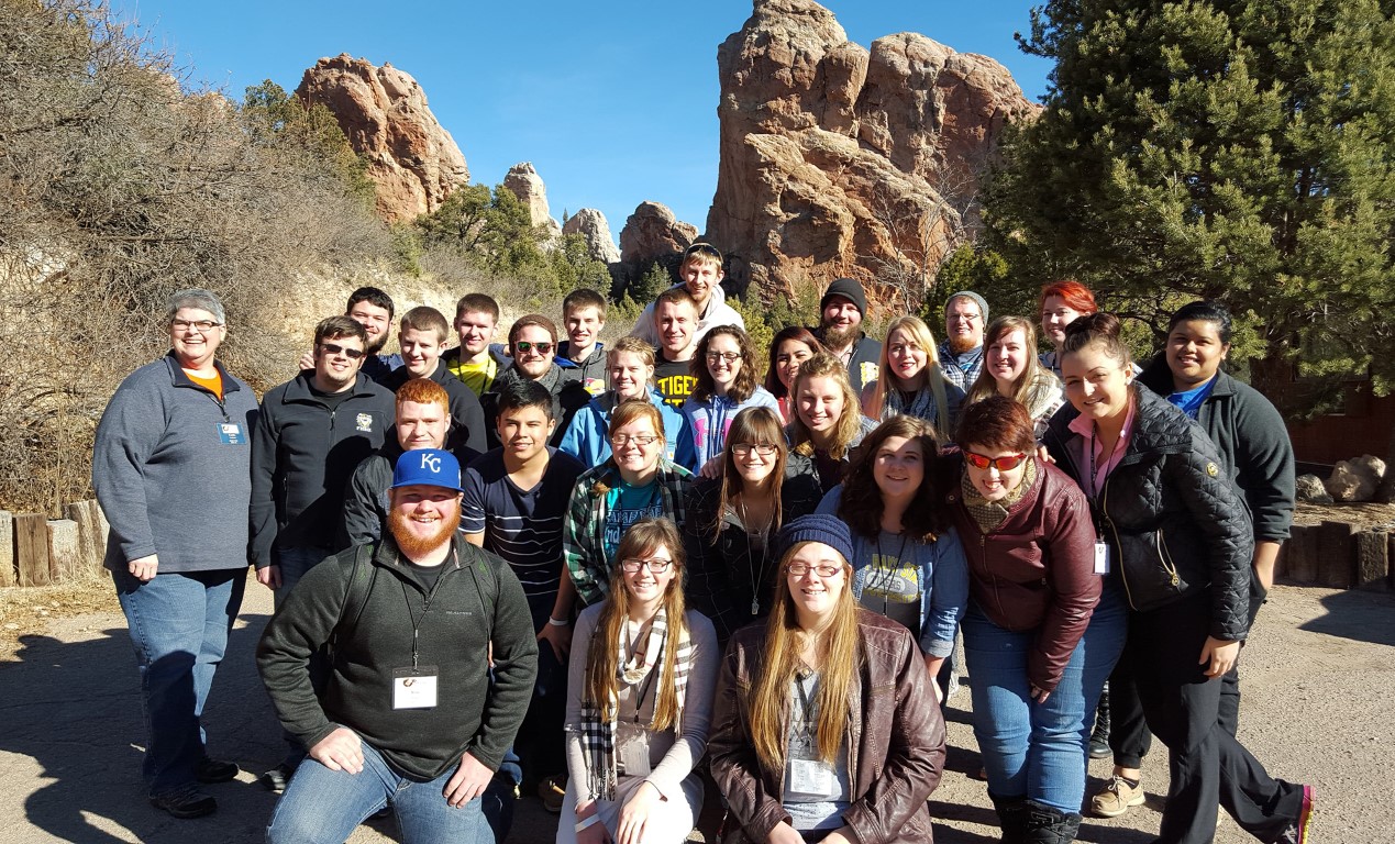 Carin Cochran (left), who has led the Christian Challenge outreach at Fort Hays State University for 25 years, gathers with FHSU attendees at the annual collegiate ministry conference sponsored by the Kansas-Nebraska Convention of Southern Baptists. Submitted photo