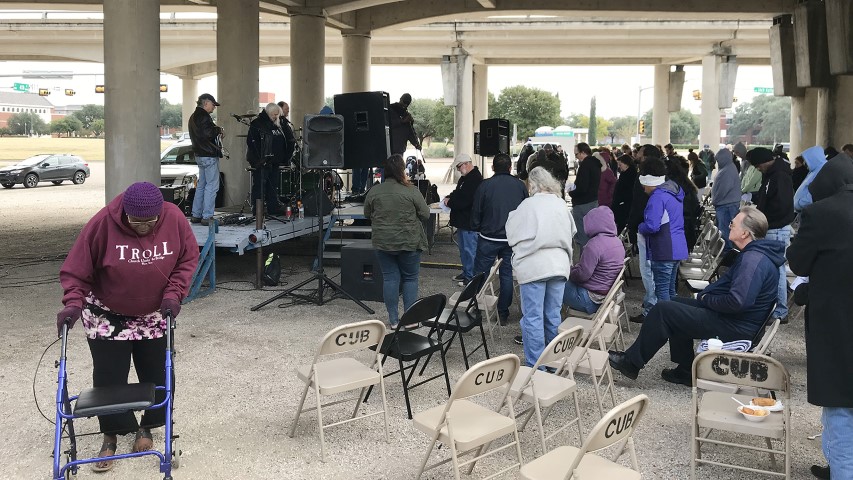 A woman wears a TROLL Church Under the Bridge hoodie as poor and homeless congregants participate in a service at Church Under the Bridge in Waco, Texas, on Nov. 18, 2018. RNS photo by Bobby Ross Jr.