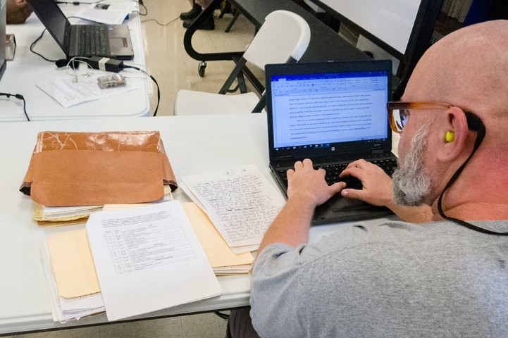 An inmate at Nash Correctional Institution works on material for a theology class in Nashville, N.C. RNS photo by Sam Morris