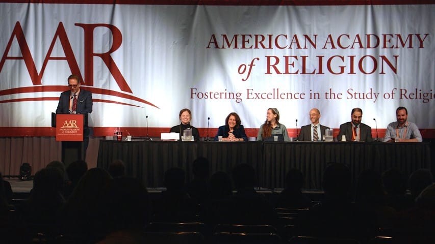 AAR President David Gushee, left, moderates a plenary panel titled “Religion Journalism and Religion Scholars: To 2020 and Beyond” on Nov. 17, 2018, at the start of the American Academy of Religion annual meeting in Denver. Panelists include (left to right) Elizabeth Dias and Laurie Goodstein, both of the New York Times; Emma Green of The Atlantic; Jerome Socolovsky of National Public Radio; Niraj Warikoo of the Detroit Free Press; and Jeremy Weber of Christianity Today. RNS photo by Emily McFarlan Miller